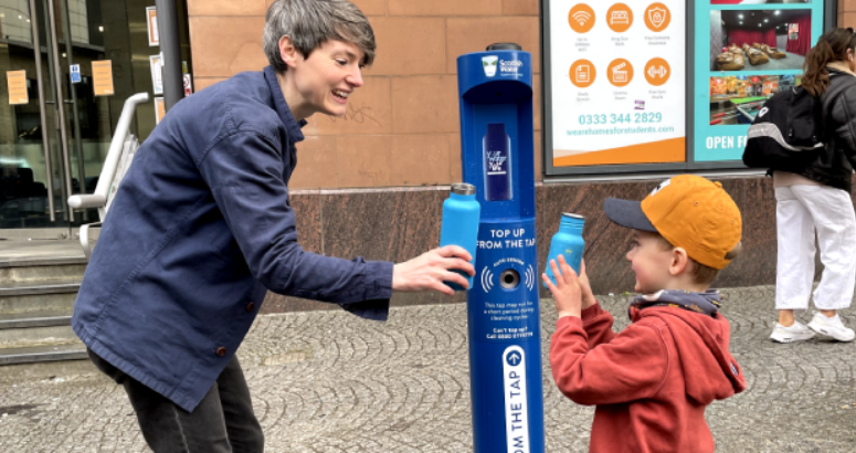 Finn Rush (4) and mum Katie enjoy a drink from Glasgow's new Top Up Tap outside Buchanan Bus Station