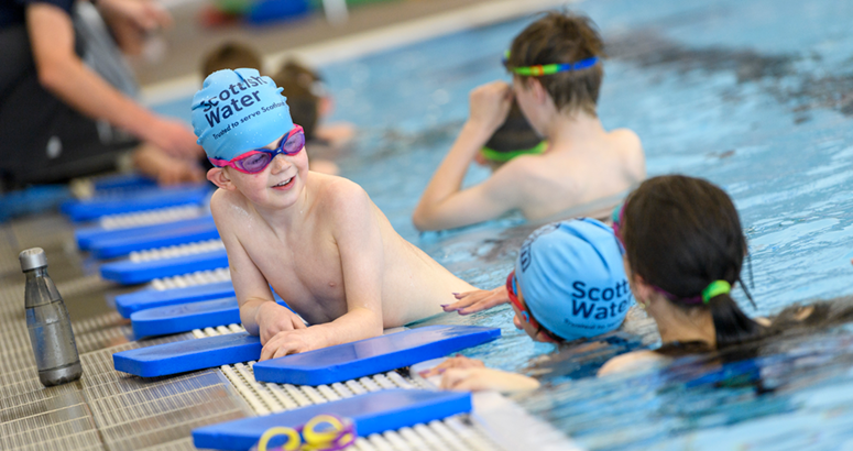 Children at side of swimming pool