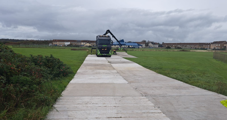 Specialised track is being laid to allow heavy machinery to access the site Stevenston Rising Sewer Main Burst