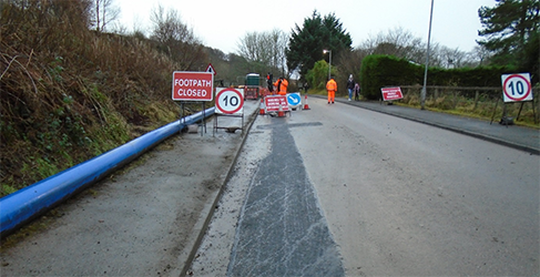 laying pipe on McCaig Road