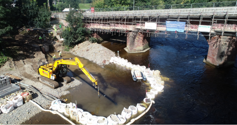 works in river installing emergency overflow outfall for pump station