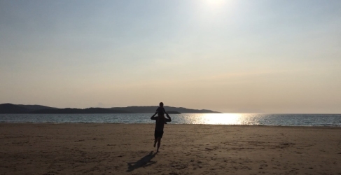 Parent and child playing on Gairloch Beach