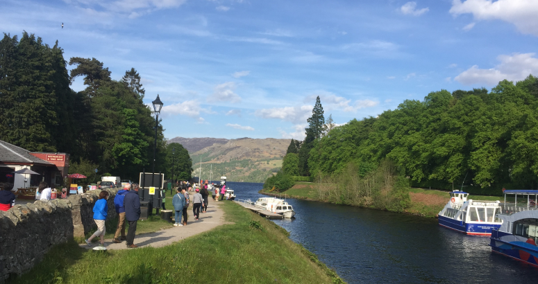 The Caledonian Canal towpath in Fort Augustus, busy with visitors
