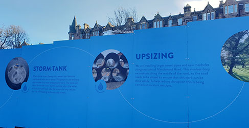 construction site hoarding with blue graphics
