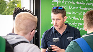 Long Term Strategy Consultation Scottish Water staff member talking to the public