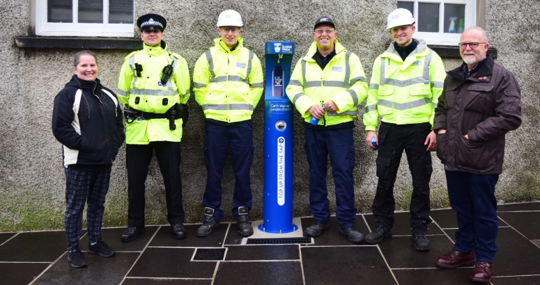 New Top up Tap in Broad Street, Kirkwall Dorothy O'Donnell of Kirkwall BID, Police Constable Simon Hay, Scottish Water apprentice Ross Whitehill, Scottish Water network maintenance operator Jon Smales, Scottish Water apprentice Sweyn Cowie and Councillor Andrew Drever of Orkney Islands Council at the new Top up Tap in Broad Street, Kirkwall
