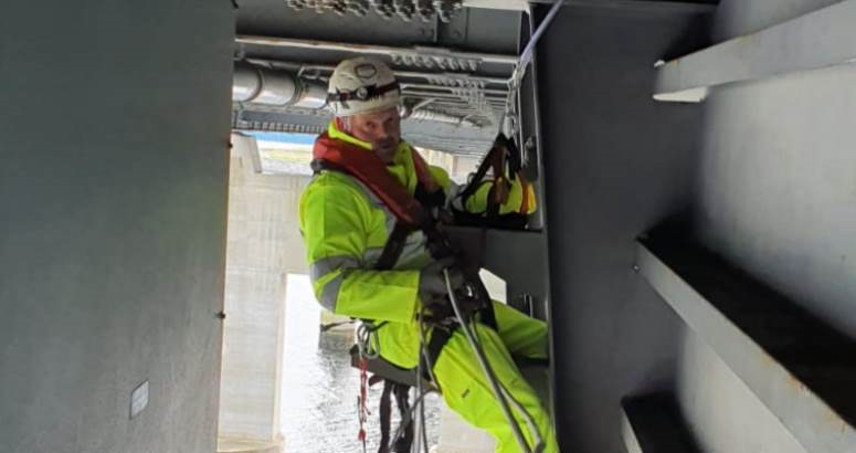 A member of the team from ALPS working below the Kessock Bridge to repair a water main