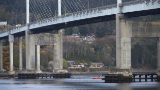 Specialist contractors abseiling from the Kessock Bridge near Inverness to repair water main