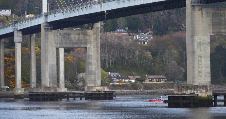 Abseiling from Kessock Bridge to repair water main, with boat on standby 30 metres below