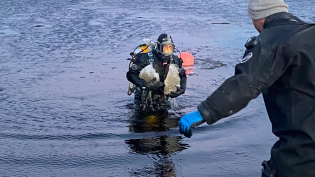 Divers working to clear intakes of ice at Loch Fada in North Uist, February 2021