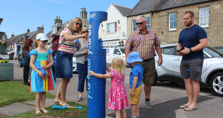 Visitors to Lossiemouth's east beach try out the new top up tap