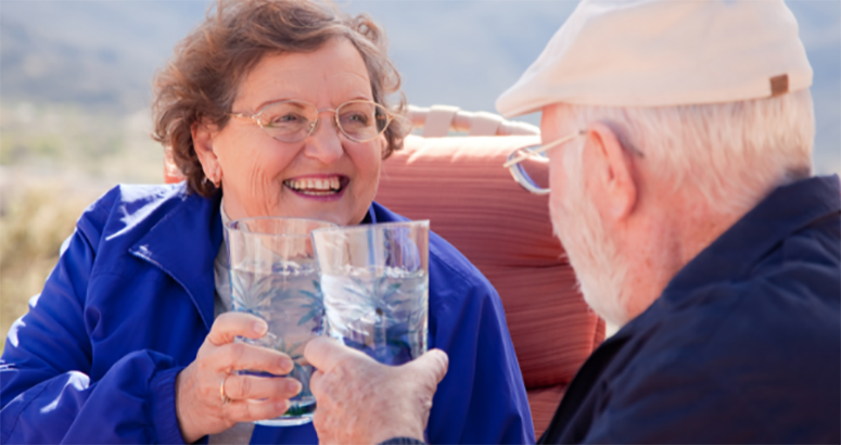 older couple drinking glasses of water