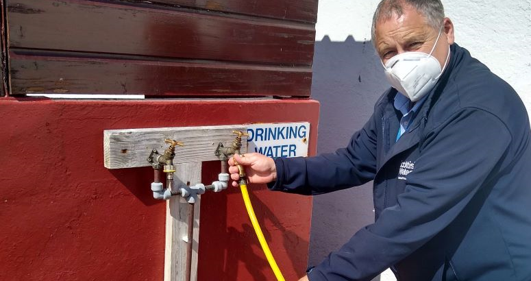 Kenny Grieve checking a water tap