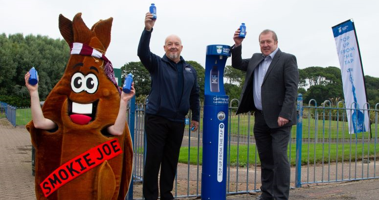 L-R Smokie Joe, Scottish Water's Mike Tocher and MSP Graeme Dey toast the new Top Up Tap