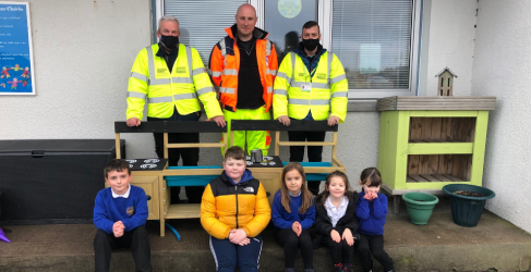 Members of the project team with pupils from Tong Primary and the new mud kitchens