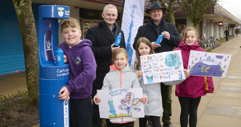 Scottish Water's Chief Operating Officer Peter Farrer joins pupils from Aviemore Primary School and Councillor Bill Lobban to launch the new Top Up Tap