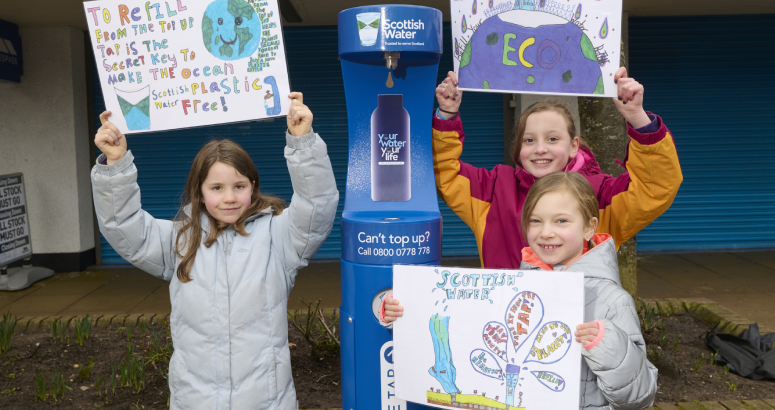 Aviemore Primary pupils Solveig Dennis, Emelia Owen and Hanna Drozd show off their winning poster designs at the new top up tap