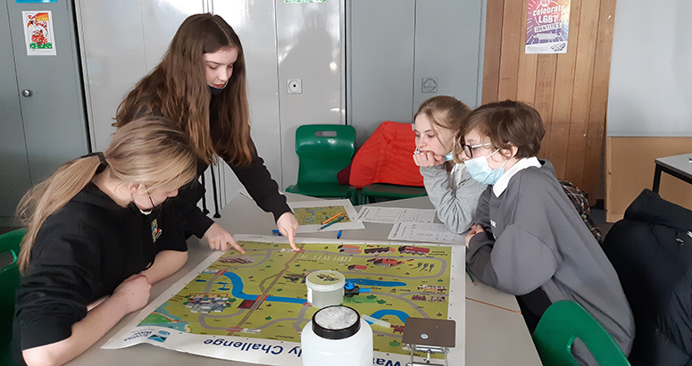 School kids working around a table