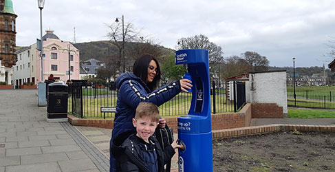 woman and child using Scottish Water Top Up Tap