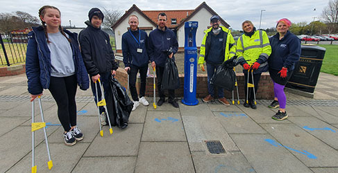 Group of people with litter pickers