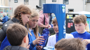 P6 pupils from Portree Primary School in Skye put the town's new Top up Tap through its paces with their new refillable water bottles