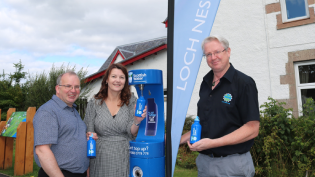Councillor David Fraser, Chair of Glenurquhart Community Council Dianne Fraser and Manager of the Loch Ness Hub Russell Fraser at the new tap