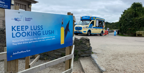 Nature Calls Luss fats oils and grease campaign Poster on loch side with ice cream van
