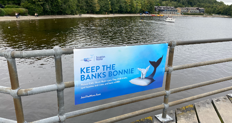 Poster on pier in Luss