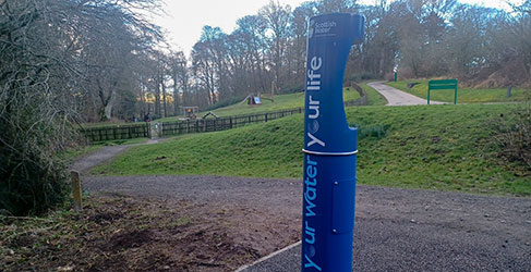 Water refill tap with playground in background