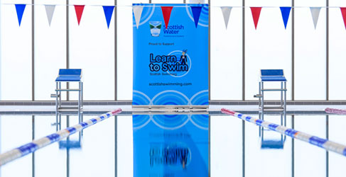 Swimming Pool with Banner at the back