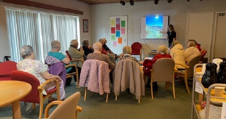 Lorna Kirkpatrick presenting to residents about her trip to Everest