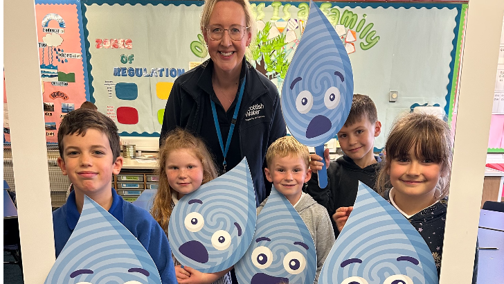 Scottish Water employee and school children