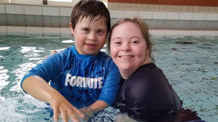 Teacher and child in a swimming pool