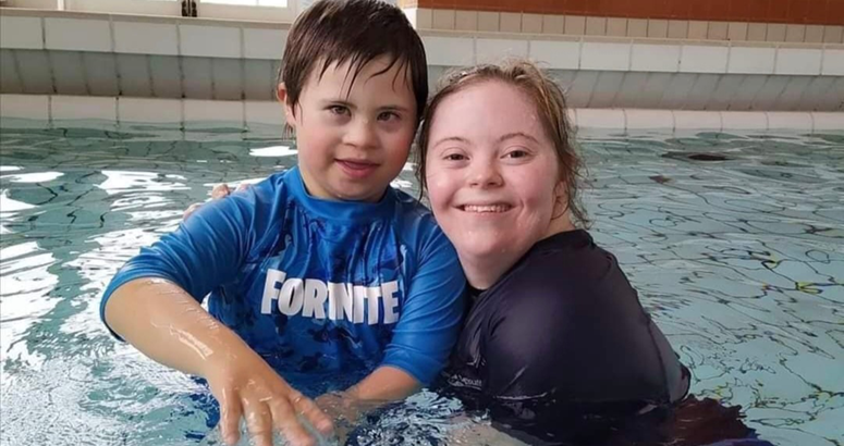 Teacher and child in a swimming pool