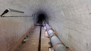 image of pipe running through tunnel