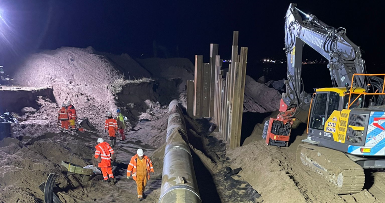 Teams from supply chain partners Geddes and Morrison Construction working in darkness to deliver a challenging pipeline repair by Carnoustie Golf Links, following major damage in the aftermath of Storm Babet