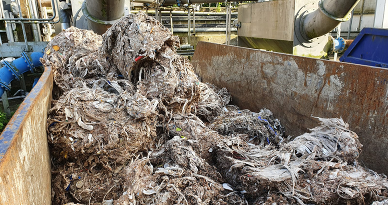 mounds of wet wipes in a skip