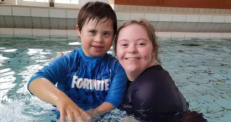 Child with Teacher in Swimming pool