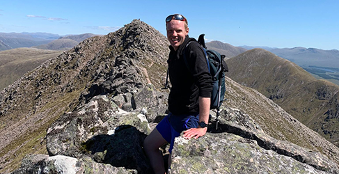 Shows Scottish Water employee Andrew Steel at the summit of Ben Staray from the 2022 Munro challenge