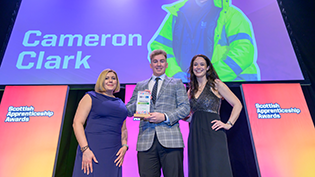 Cameron Clark Scottish Water apprentice Cameron Clark receiving his award for Net Zero Apprenticeship of the Year at the Scottish Apprenticeship Awards