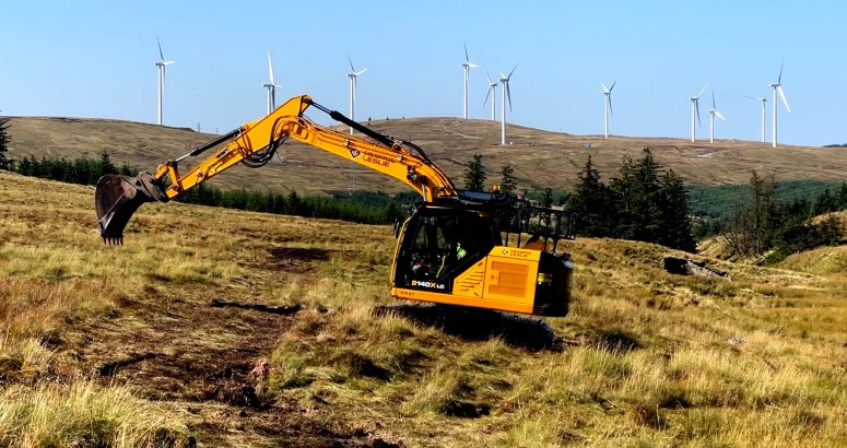 A digger at work on a peatland restoration site at Afton Reservoir, East Ayrshire A digger at work on a peatland restoration site at Afton Reservoir, East Ayrshire