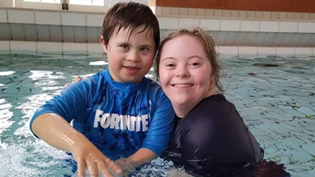 Child with Teacher in Swimming pool