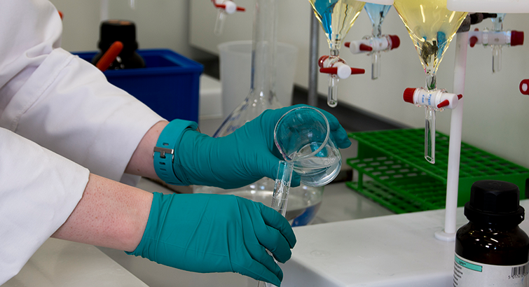 Pouring liquid  into a Beaker