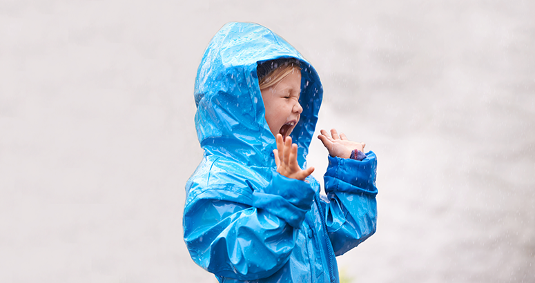 Girl with blue rain coat