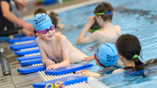Children at side of swimming pool