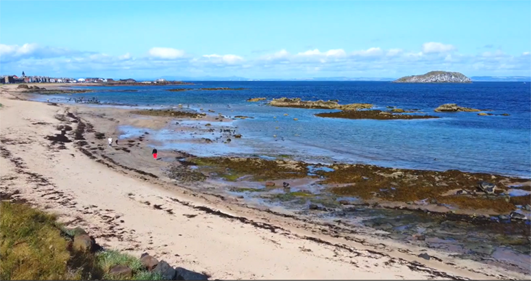 aerial shot of a beach and the north sea