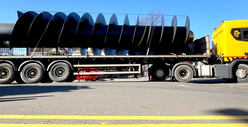 The screw pump is shown securely fastened in place on a wagon