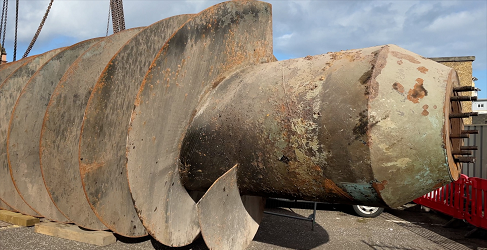 The old foul screw pump is shown having been removed from the ground at McDonald Road Pumping Station
