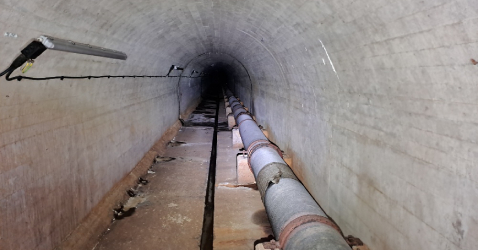 image of pipe running through tunnel
