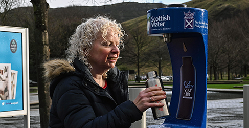 Claire Baker MSP filling up at the top up tap at Holyrood to mark 20 million bottle milestone